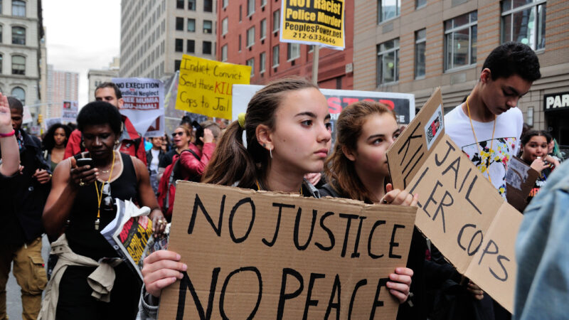 Image of protesters with no justtice no peace sign