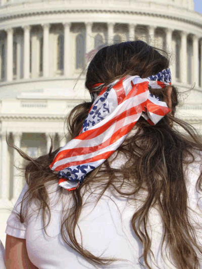Three women wearing american flags