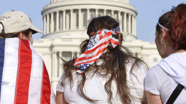 Three women wearing american flags
