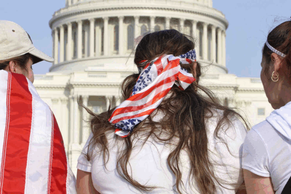 Three women wearing american flags