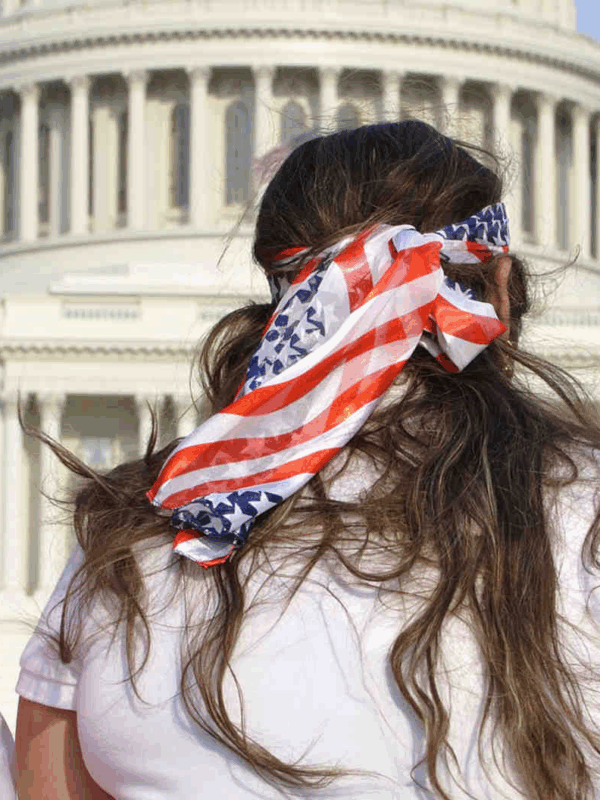 Three women wearing american flags