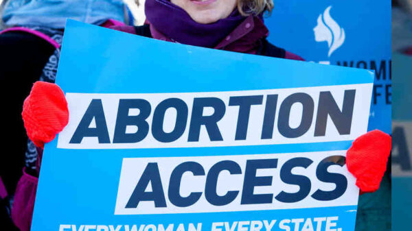 lady holding abortion access sign