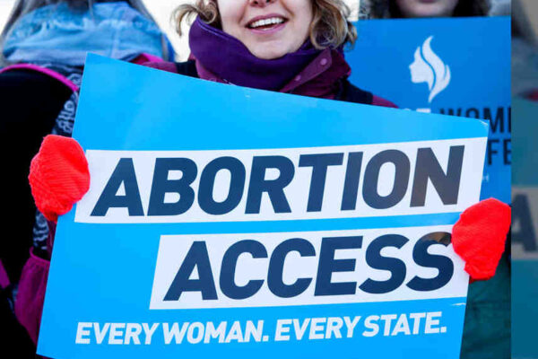 lady holding abortion access sign