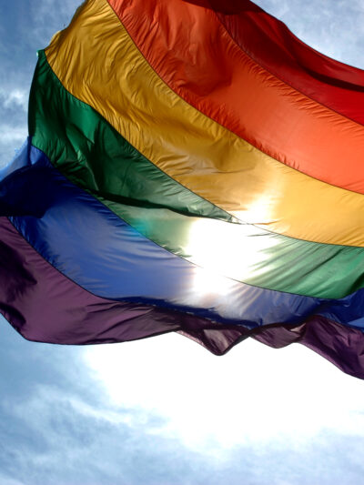 rainbow flag in blue skies