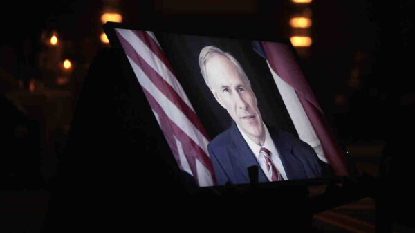 Greg Abbott on TV monitor screen