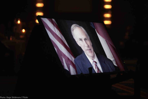 Greg Abbott on TV monitor screen