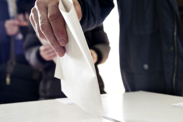 image of someone casting their ballot