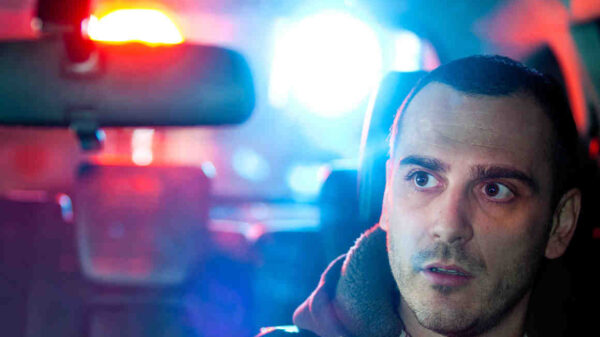 man in car getting pulled over