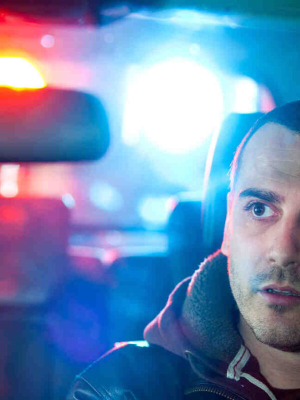 man in car getting pulled over