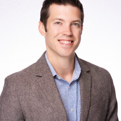 Image of Brian in a grey and blue suit