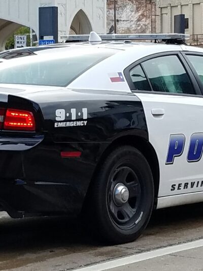Image of a city of Dallas police squad car from the rear