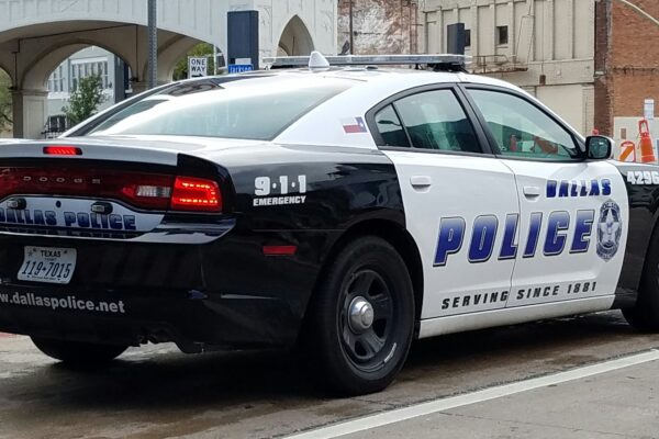 Image of a city of Dallas police squad car from the rear