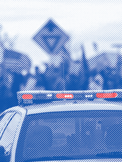 Police car with lights on roof highlighted