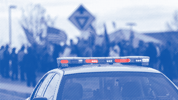 Police car with lights on roof highlighted
