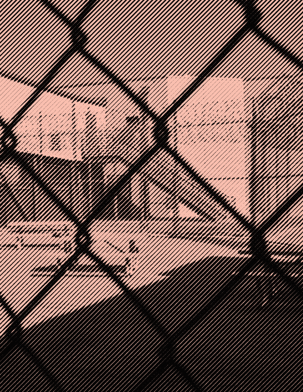 Image: A stylized photo shows an outdoor area of a detention center with some benches and tables. It is surrounded by barbed wire and concertina wire. The camera's view is partially obscured by the barbed wire fencing.