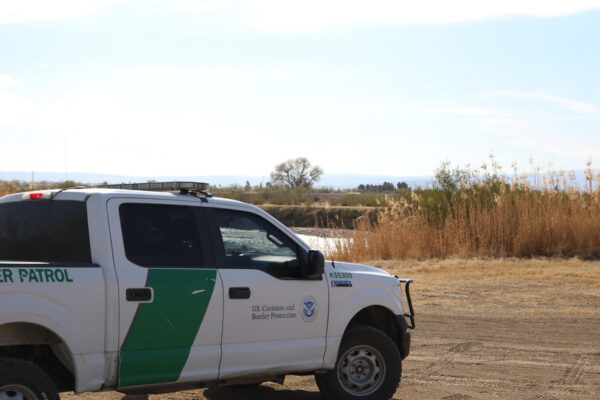 Photograph of a Customs and Border Protection truck parked on the side of the road