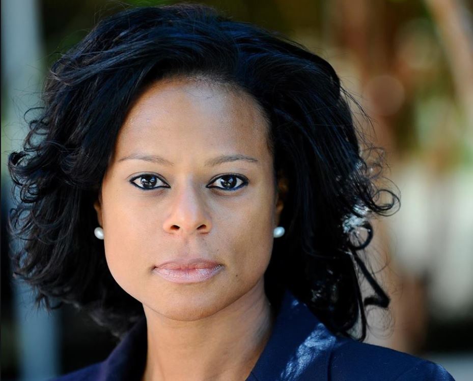 Photo: Nicole Collier poses for a photo outdoors.