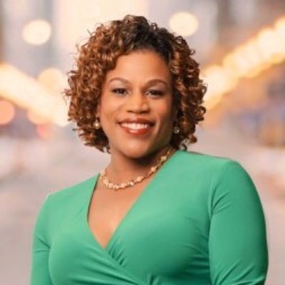 Photo: Tarsha Jackson poses for a portrait in front of a background of city lights