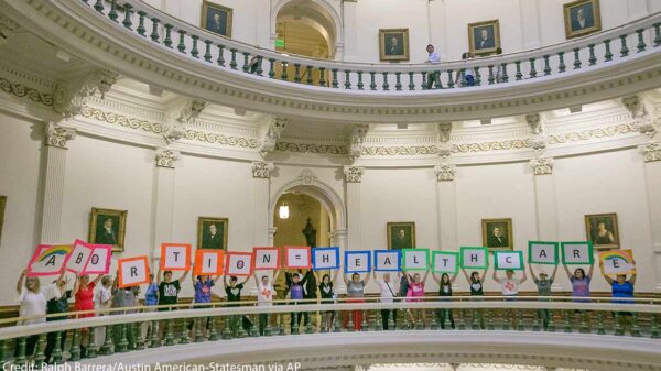 Photo: Representatives of the Trust, Respect, Access Coalition, holding multicolored signs spelling out ABORTION=HEALTHCARE, gathered in the Texas Capitol Rotunda Thursday afternoon July 27, 2017 to voice their opposition to abortion legislation being...