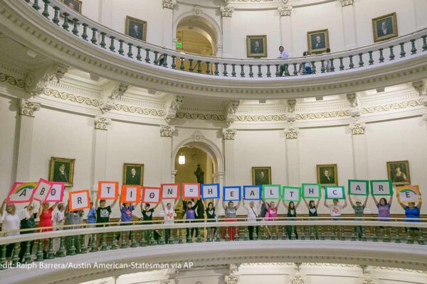 Photo: Representatives of the Trust, Respect, Access Coalition, holding multicolored signs spelling out ABORTION=HEALTHCARE, gathered in the Texas Capitol Rotunda Thursday afternoon July 27, 2017 to voice their opposition to abortion legislation being...