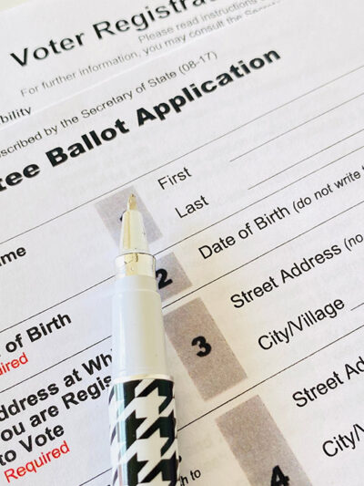 Photo: A paper application for absentee ballot is shown.