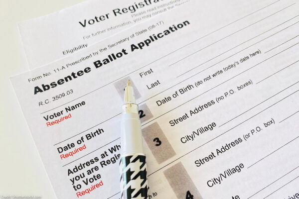 Photo: A paper application for absentee ballot is shown.