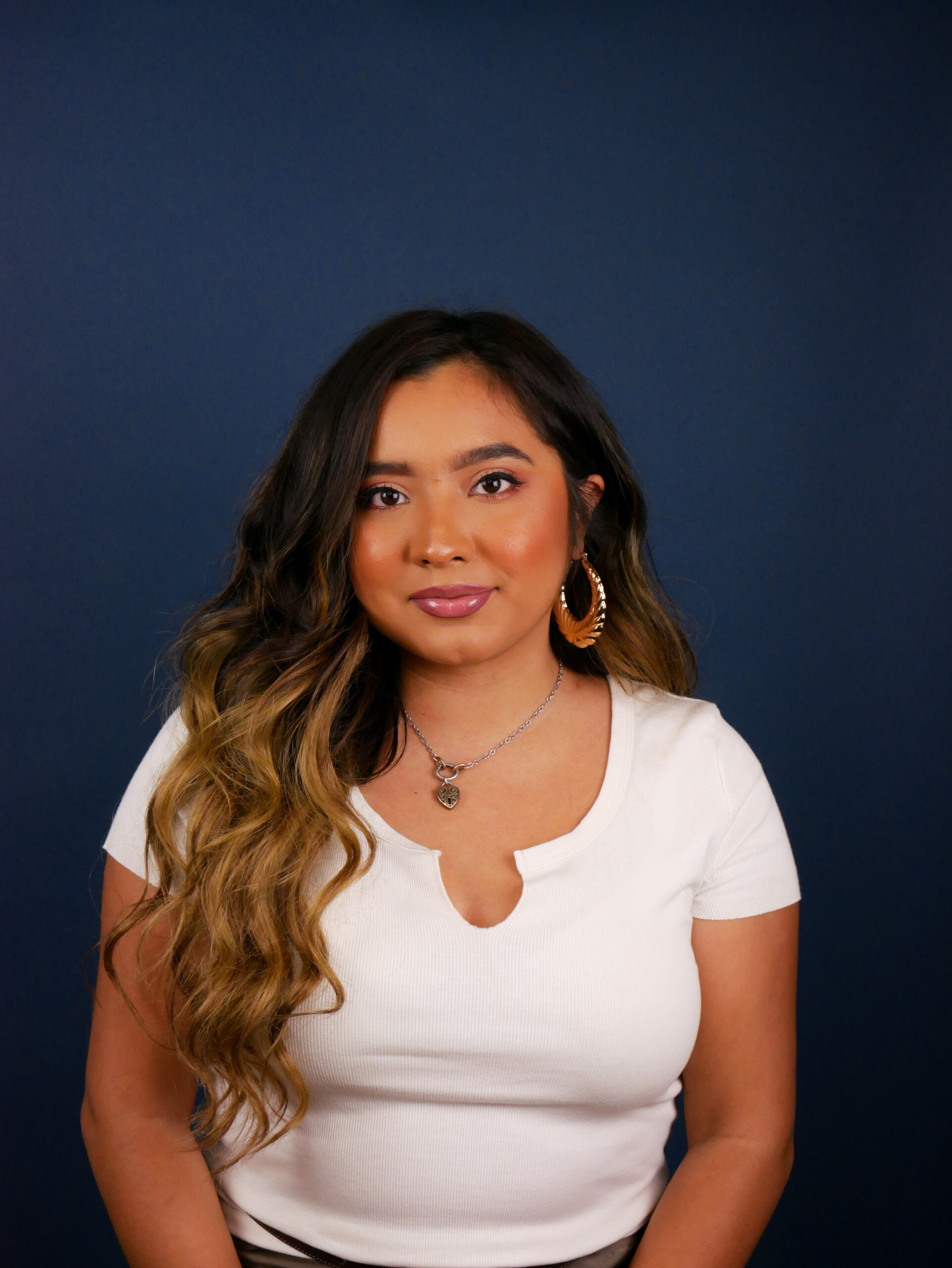 Photo: Ofelia Alonso poses for a photo in front of a dark backdrop