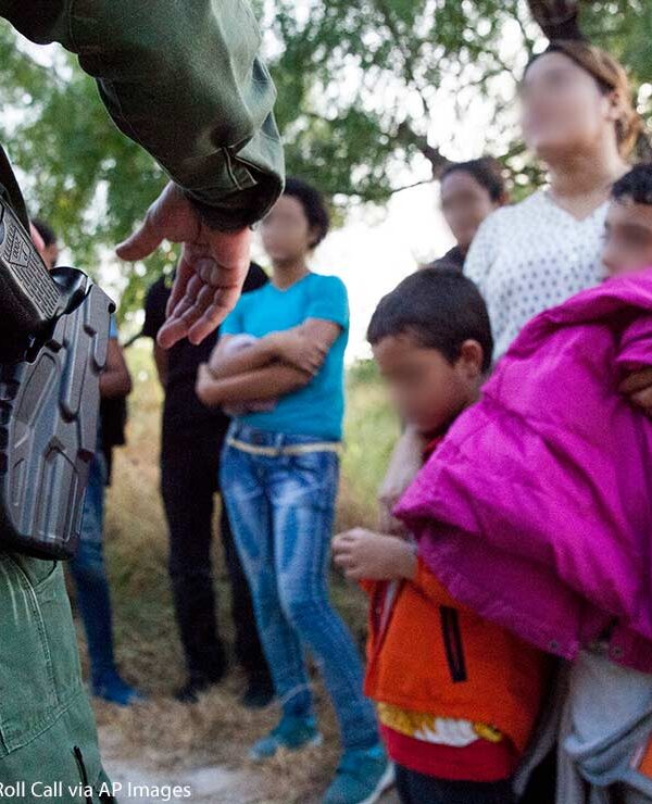 A Customs and Border Protection officer questions immigrants in Rio Grande Valley sector of the Texas border on Aug. 20, 2019.