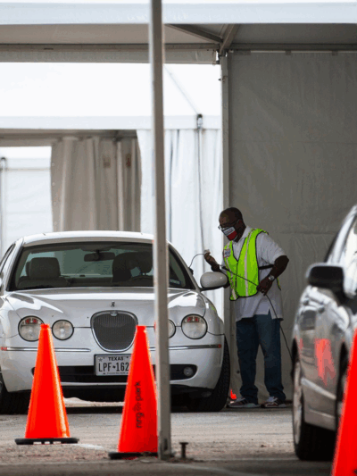 Cars line up during the pandemic to vote by drive-thru