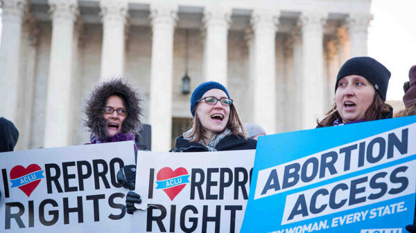 People holding pro-abortion signs in front of the Supreme Court