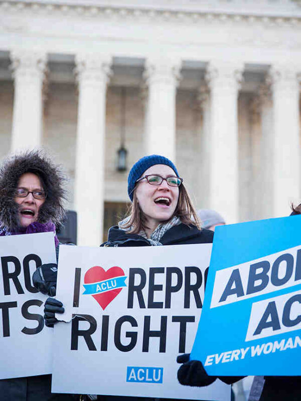 People holding pro-abortion signs in front of the Supreme Court