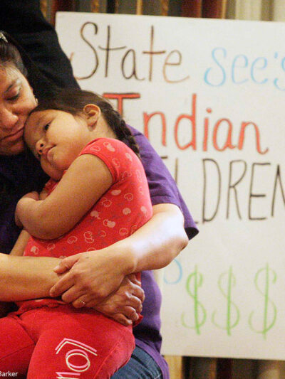 A woman holding a child.