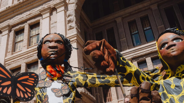 Giant puppets rally for immigrants' rights against Texas anti-immigrant law SB4