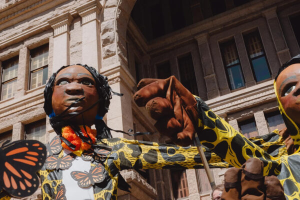 Giant puppets rally for immigrants' rights against Texas anti-immigrant law SB4