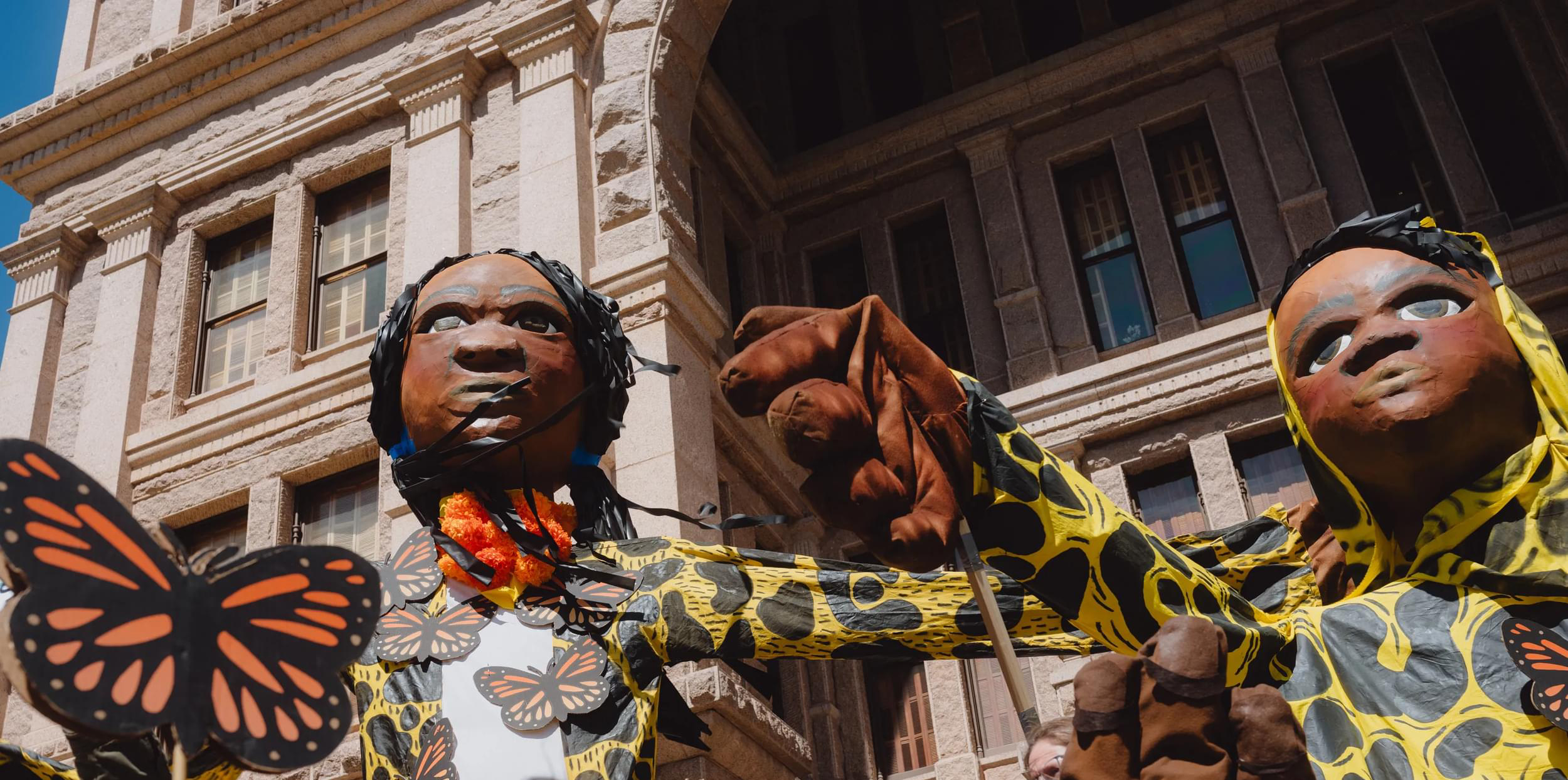 Giant puppets rally for immigrants' rights against Texas anti-immigrant law SB4