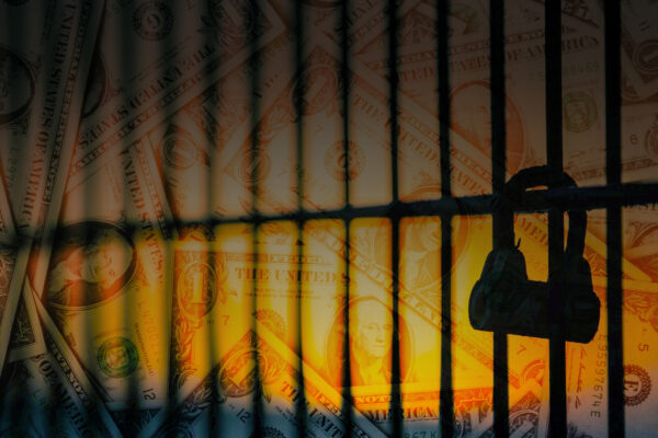 jail bars across a background of money