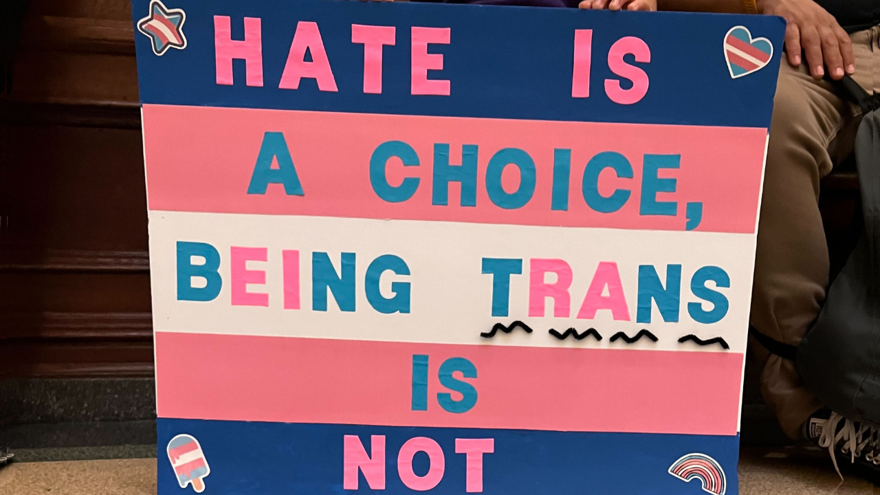 sign that says 'hate is a choice, being trans is not'