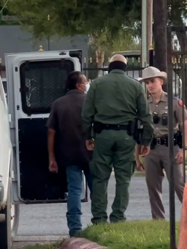 image of border patrol detaining someone