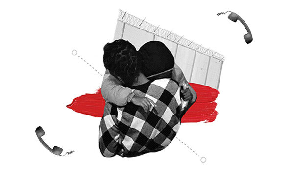 Shows two pwoplw hugging with a fence and a phone is the background