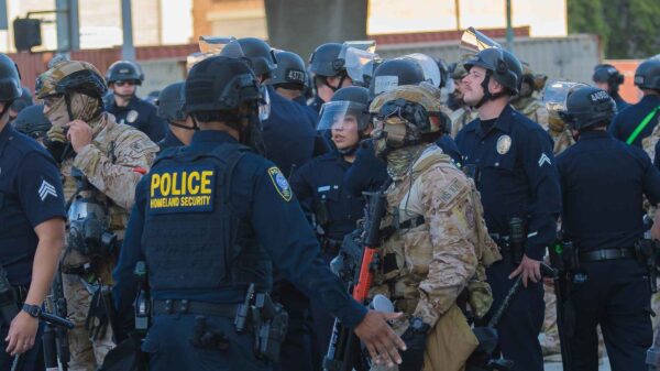 Photo focused on a group of military agents and police officers walking in the street.