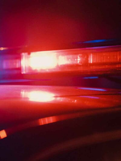 Close-up photo of the red and blue lights on top of a police car