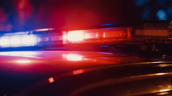 Close-up photo of the red and blue lights on top of a police car