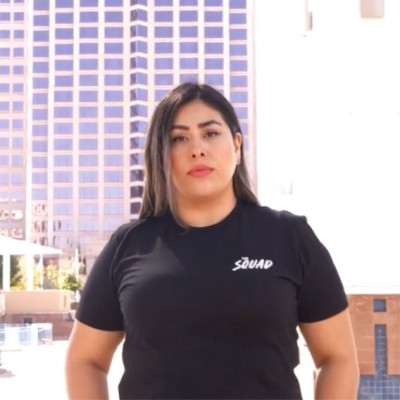 image of Ivonne Diaz in front of a city skyline outside