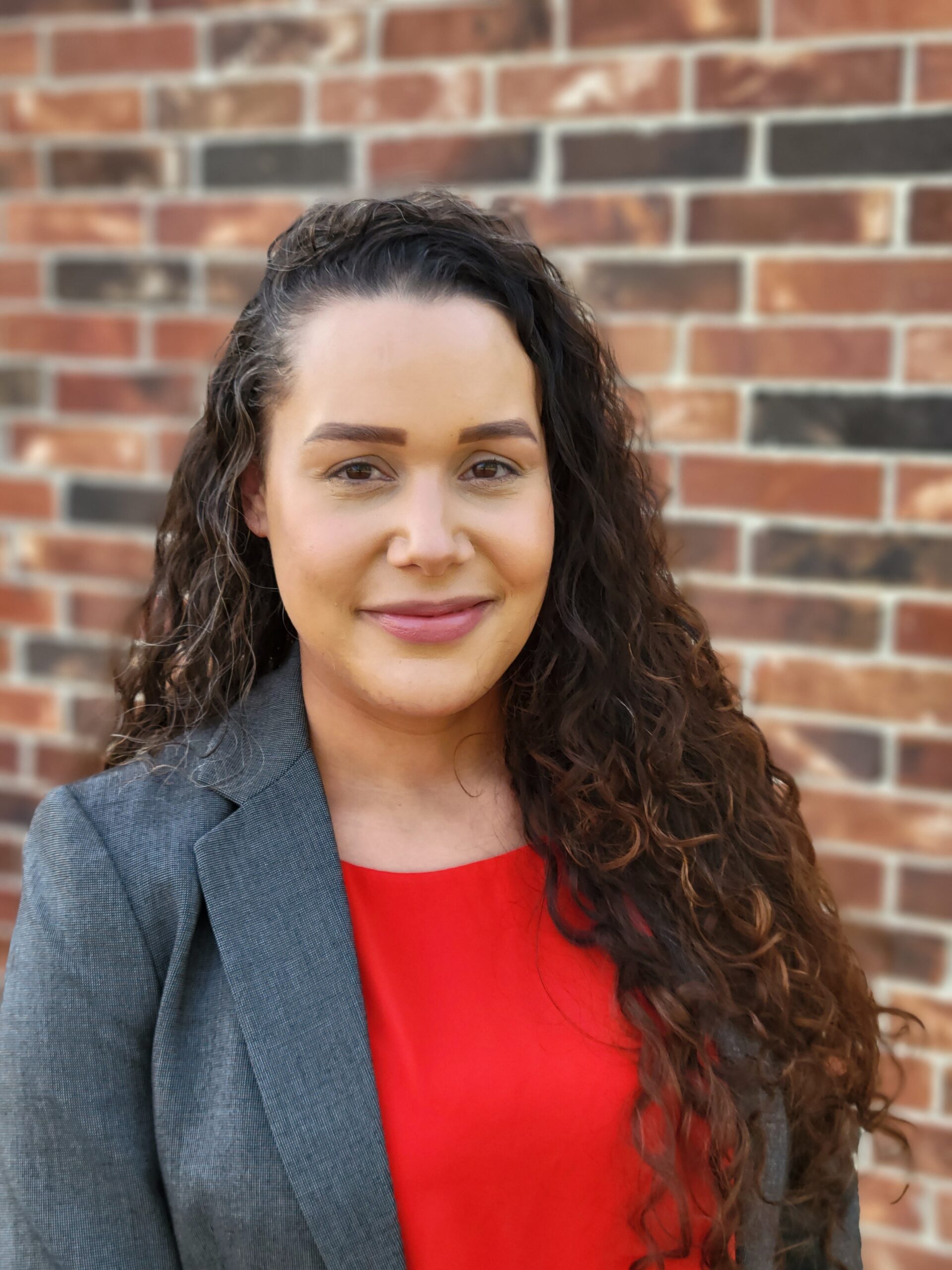 Image of Shelby Taylor in front of a brick wall