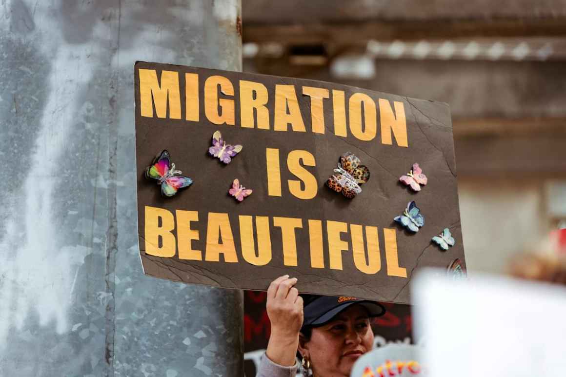 Sign that reads "Migration is beautiful"