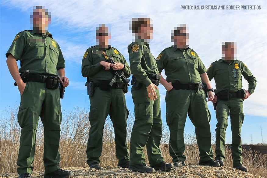 border patrol agents in their green uniforms