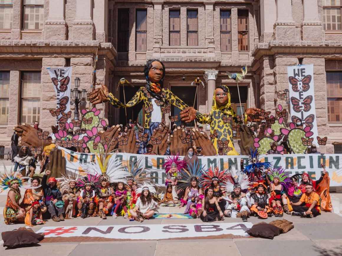 Giant puppets and art at rally for immigrants' rights in Austin