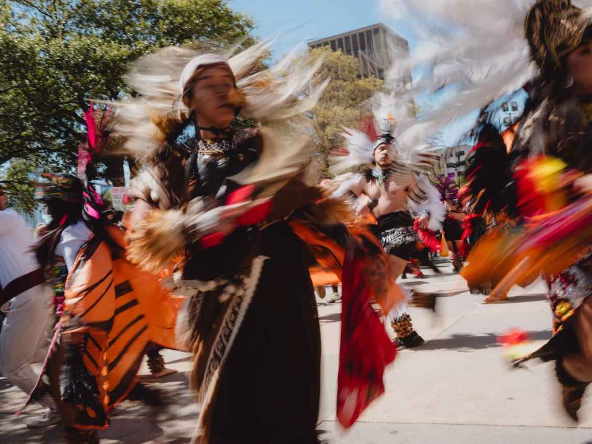 Danzantes dance at a rally for immigrants' rights against SB4