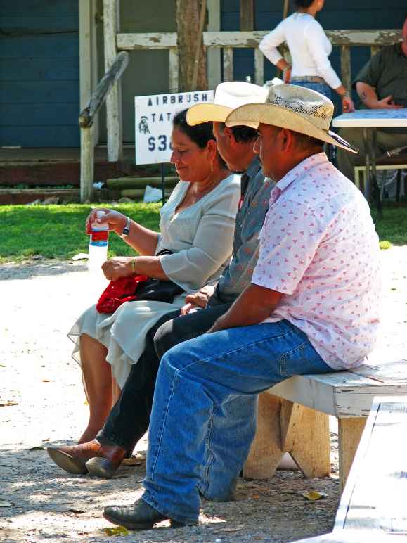 3 people sitting on a bench