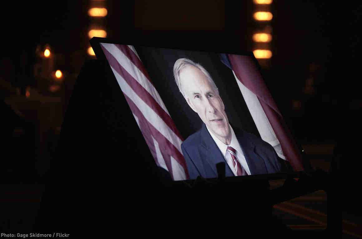 Greg Abbott on TV monitor screen